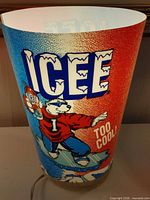 Front view of illuminated ICEE sign showing full graphic and lighting