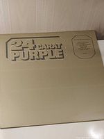 Front cover showing gold sleeve and album title