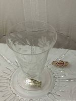 Cornflower etched liquor glass on cake plate, labels visible