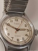 Front view of Almedy watch showing dial and hands