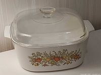 Front angled view of Corning Ware Spice of Life casserole with glass lid