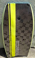 Top deck of Body Glove bodyboard showing logo, stripe and wear