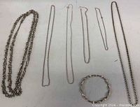 All seven jewelry pieces laid flat