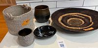 Group shot of all five items: woven tray, rope basket, three ceramic pieces