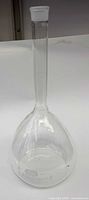 Full view of volumetric flask showing overall shape and stopper