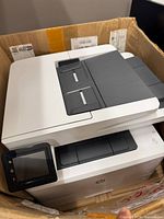 Printer angled view showing touchscreen, ADF and HP logo