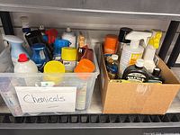 Two boxes of assorted cleaning chemicals