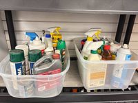 Both plastic totes with assorted chemical products