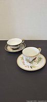 Two cup and saucer sets side by side showing overall appearance