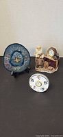 Group shot of agate clock, porcelain disk clock and figurine clock