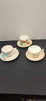 All three cup and saucer sets overview
