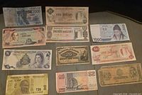 Front sides of 11 assorted banknotes laid out