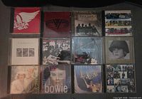 Overall view of 12 CD albums in three-row grid showing front artwork