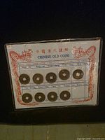 Display card titled "Chinese Old Coins" holding nine Qing Dynasty cash coins