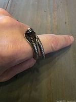 Ring worn on finger showing full cobra shape