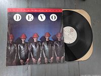 Front cover of Devo Freedom of Choice album with vinyl partially visible