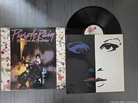 Front cover next to inner sleeve and vinyl record