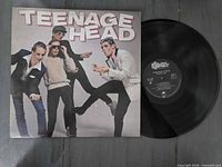 Front sleeve artwork and vinyl record visible