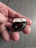 Ring with size tag showing tungsten composition