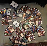 overhead view of numerous Vs. System cards spread on table