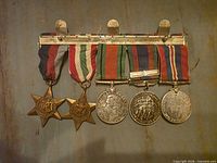 Front view of medal group showing ribbons and obverses