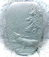 Front view showing woodland relief with stag