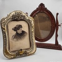 Front view of both photo frames showing design details and included portrait photo