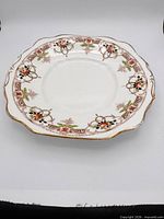 Front view of Diamond China floral serving plate showing pattern and gilt rim