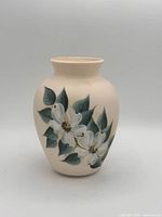 Front view of vase displaying floral painting and overall condition