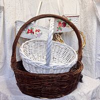 Group shot showing large dark brown basket with white and fruit-decal baskets nested inside