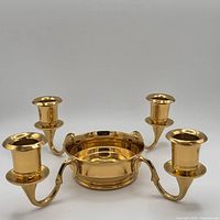 Top view showing four arms and center well of brass candelabra