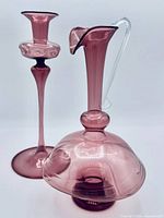 Pair of mauve art glass bud vase and pitcher
