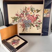 Boxes opened to show placemats and coasters with matching pattern