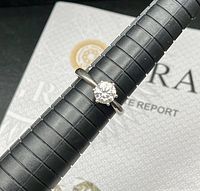 Ring on mandrel showing solitaire stone and size 7 mark