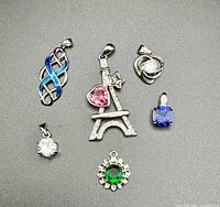 All six pendants arranged on flat surface