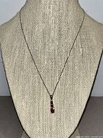 Full view of necklace on bust showing chain length and pendant