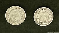 Reverse of both coins showing dates 1914 and 1903