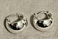 Front view showing full pair of chunky silver hoops