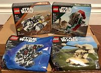 Front view of all four sealed Lego Star Wars sets