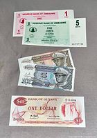 Fronts of all five banknotes showing denominations and issuing authorities