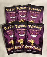 Front view of six sealed Pokémon Trick or Trade booster packs