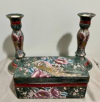 Box and pair of candlesticks showing matching design