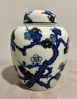 Front view of porcelain ginger jar with lid showing floral design