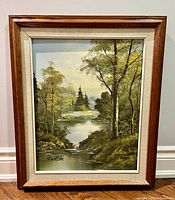Framed forest landscape painting front view