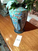 Vase close-up showing enamel decoration and wear