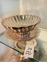 Scalloped sterling or silver footed compote on glass shelf with lot tag