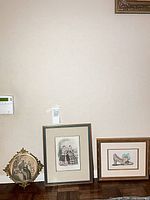 All three framed pieces displayed side by side