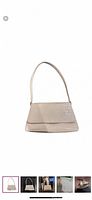 Front view of cream croc-embossed shoulder bag