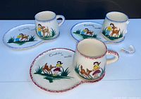 Overall view of three cup & plate sets showing designs and broken handle