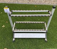 Front view of aluminum vertical rod holder showing both tiers and base shelf
